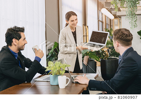 Smart women happy presentation her jobs or working result presenter to male teamwork in modern office meeting room. Smart women happy presentation her jobs or working result presenter to male teamwork in modern office meeting room. 81060907