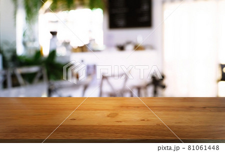 Empty wooden table in front of abstract blurred background of coffee shop . can be used for display or montage your products.Mock up for display of product. Empty wooden table in front of abstract blurred background of coffee shop . can be used for display or montage your products.Mock up for display of product. 81061448