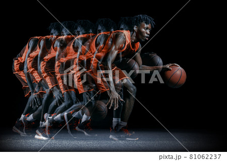 Young african man, basketball player in motion with ball isolated over black background. Stroboscopic effect Young african man, basketball player in motion with ball isolated over black background. Stroboscopic effect 81062237