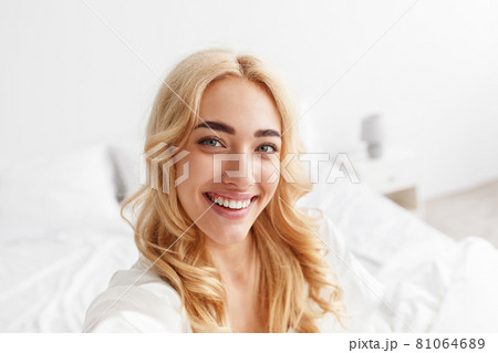 Happy blogger, streaming video, photo for social networks, beautiful model at home 81064689