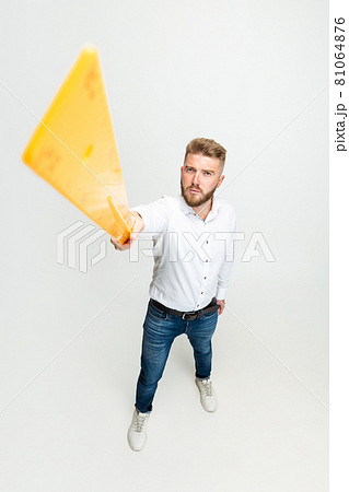 High angle view of funny bearded man, builder, designer or architect with professional equipment isolated on white studio background. 81064876