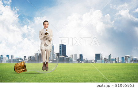 Attractive woman playing trumpet brass 81065953
