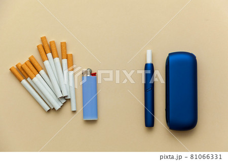 Iqos electronic blue cigarette on a beige background. 81066331