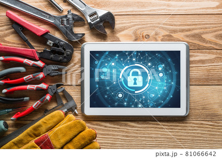 Web security and technology concept with tablet pc on wooden table 81066642
