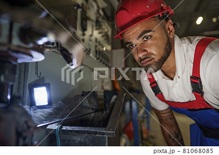 Portrait of african american male handyman working in an industrial factory Portrait of african american male handyman working in an industrial factory 81068085