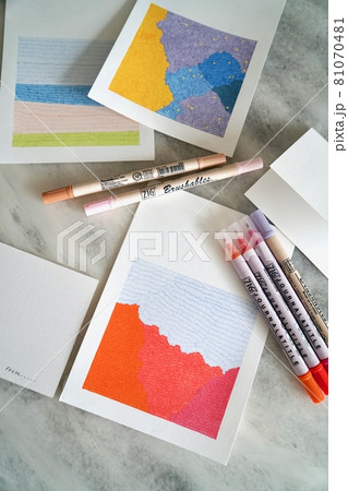 Colored pencils and papers on white background Colored pencils and papers on white background 81070481