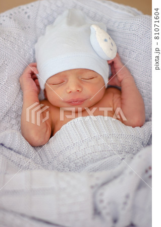Sleeping newborn baby boy with funny hat. Babyface close-up. Very sweet infant. Sleeping newborn baby boy with funny hat. Babyface close-up. Very sweet infant. 81071604