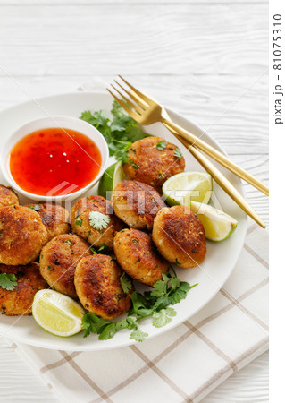 Tod man pla, thai fish cakes on a plate 81075310