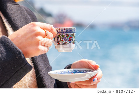 hand with turkish coffee cup and flag. Travel concept 81077127