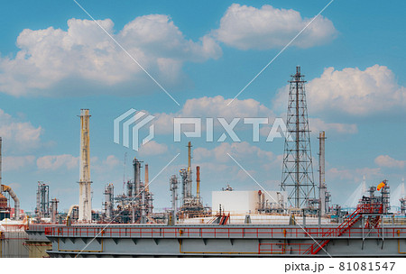 Oil refinery or petroleum refinery plant with blue sky background. Power and energy industry. Oil and gas production plant. Petrochemical industry. Natural gas storage tank. Petroleum business. 81081547