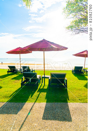 umbrella and beach chair with sea beach background and blue sky umbrella and beach chair with sea beach background and blue sky 81082760