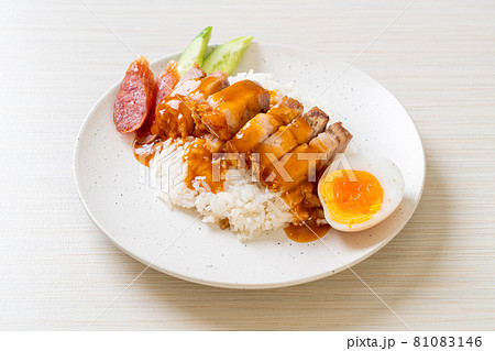 crispy pork on rice with barbecue sauce crispy pork on rice with barbecue sauce 81083146