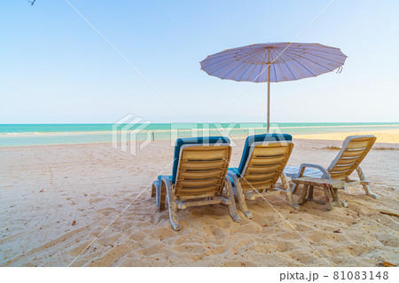 beach chair on sand with ocean sea background beach chair on sand with ocean sea background 81083148