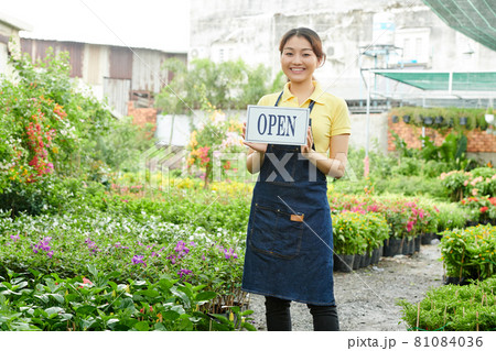 Woman Opening Plant Nursery Woman Opening Plant Nursery 81084036