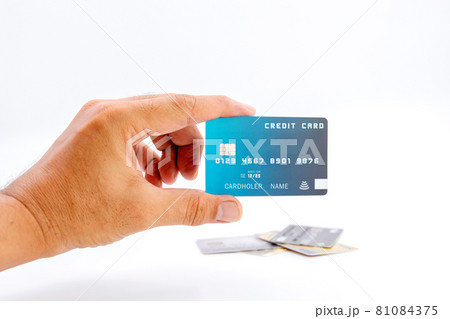 Hand holding bank credit cards on white background. 81084375