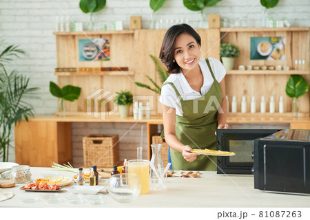 Woman Drying Orage Slices 81087263