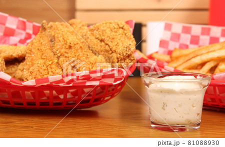 Fried Catfish With Tartar Sauce and French Fries in Cafe 81088930