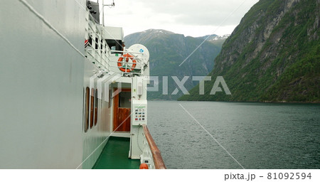 Sunnylvsfjorden, Norway. Touristic Ship Ferry Boat Floating Through Waters Of Sunnylvsfjorden In Spring Summer Day. Famous Norwegian Landmark And Popular Destination Sunnylvsfjorden, Norway. Touristic Ship Ferry Boat Floating Through Waters Of Sunnylvsfjorden In Spring Summer Day. Famous Norwegian Landmark And Popular Destination 81092594