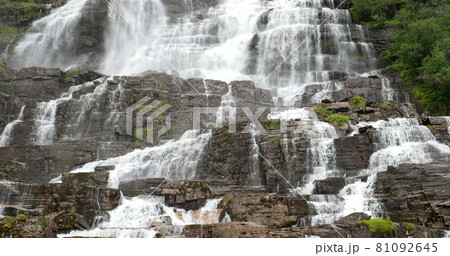 Voss, Hordaland, Norway. Waterfall Tvindefossen In Spring. Waterfall Tvindefossen Is Largest And Highest Waterfall Of Norway. Famous Natural Norwegian Landmark And Popular Destination Voss, Hordaland, Norway. Waterfall Tvindefossen In Spring. Waterfall Tvindefossen Is Largest And Highest Waterfall Of Norway. Famous Natural Norwegian Landmark And Popular Destination 81092645