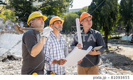Demolition control supervisor and contractor discussing on demolish building. Demolition control supervisor and contractor discussing on demolish building. 81093655