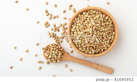 Buckwheat in wood bowl with spoon Buckwheat in wood bowl with spoon 81095952