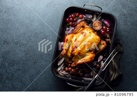 Fried chicken or turkey in a dark baking tray, top-down view Fried chicken or turkey in a dark baking tray, top-down view 81096795