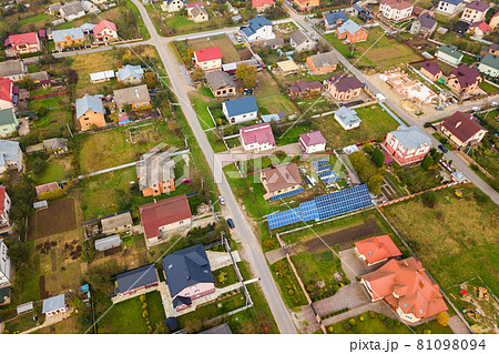 Aerial view of home roofs in residential rural neighborhood area. Aerial view of home roofs in residential rural neighborhood area. 81098094
