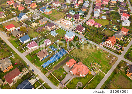 Aerial view of home roofs in residential rural neighborhood area. 81098095