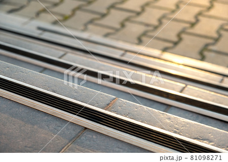 Closeup of ceramic tiles covering porch stairs with rubber anti slippery stripes on it. Closeup of ceramic tiles covering porch stairs with rubber anti slippery stripes on it. 81098271