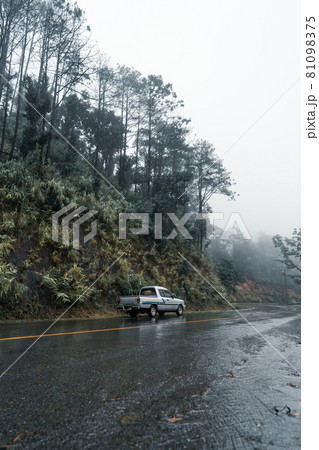Mountain road in rainy and foggy day 81098375