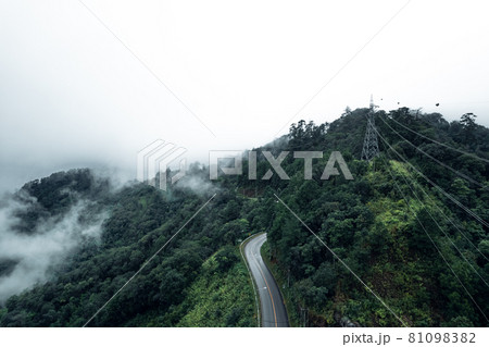 Mountain road in rainy and foggy day Mountain road in rainy and foggy day 81098382