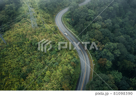 Mountain road in rainy and foggy day Mountain road in rainy and foggy day 81098390