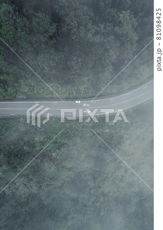 Mountain road in rainy and foggy day Mountain road in rainy and foggy day 81098425