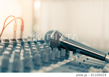 Microphone voice speaker on karaoke or audio synthesiser electronic music instrument sound mixer in radio broadcasting studio room, seminar event, show or wedding party 81100029
