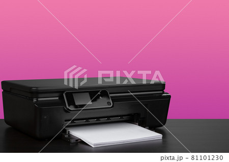 Compact home laser printer against pink background Compact home laser printer against pink background 81101230