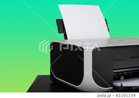 Home laser printer on desk against green background Home laser printer on desk against green background 81101239
