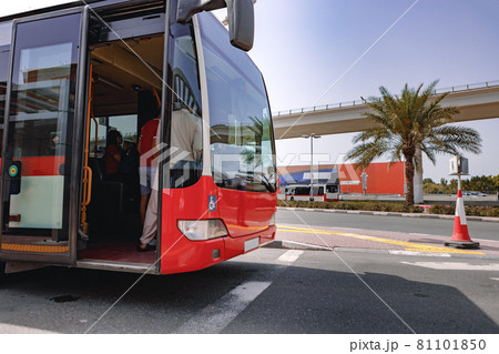 A close up shot of a regular old red bus 81101850