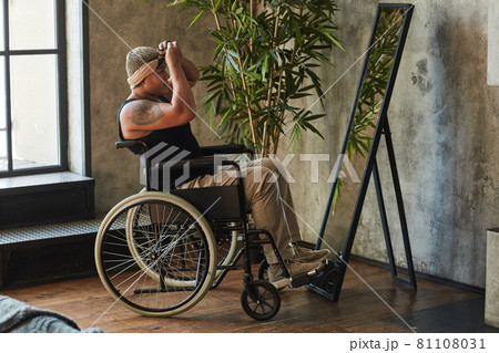 Person in Wheelchair Looking at Mirror Person in Wheelchair Looking at Mirror 81108031