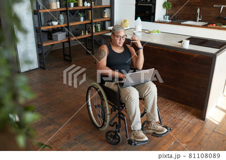 Modern Woman with Disability Working Modern Woman with Disability Working 81108089