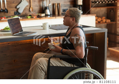 Young Woman with Disability Watching Videos Online Young Woman with Disability Watching Videos Online 81108111