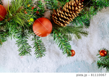 Merry Christmas decorative ball on snow with branch pine cone 81110067