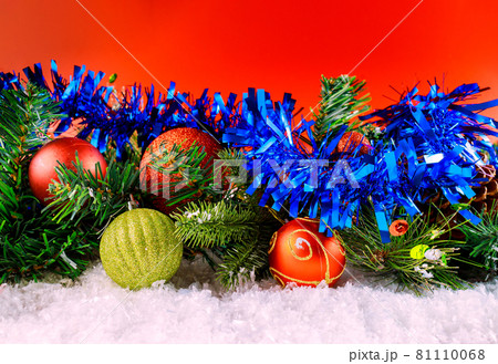Merry christmas and New Year decoration snow winter in the ball snowflakes on branch with pine cone red background 81110068