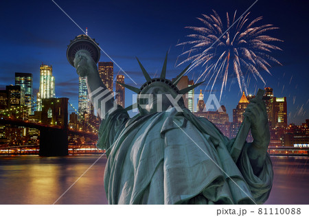 Firework over city at night with Statue of Liberty in Manhattan New York City USA s over Manhattan Firework over city at night with Statue of Liberty in Manhattan New York City USA s over Manhattan 81110088