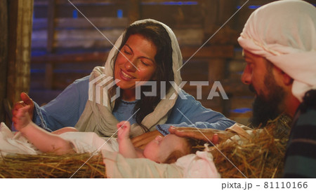 Mary and Joseph kissing and touching baby Jesus 81110166