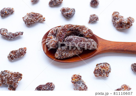 Spicy tamarind mixed with granulated sugar, chili and salt Spicy tamarind mixed with granulated sugar, chili and salt 81110607