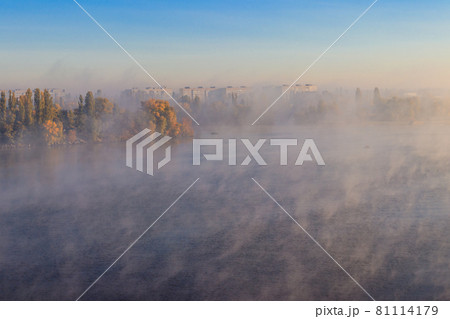 View on the Kremenchug city and Dnieper river, Ukraine in fog at autumn View on the Kremenchug city and Dnieper river, Ukraine in fog at autumn 81114179