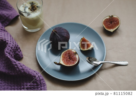 breakfast with ripe fresh figs on a plate on rustic background, flatlay, overhead view breakfast with ripe fresh figs on a plate on rustic background, flatlay, overhead view 81115082