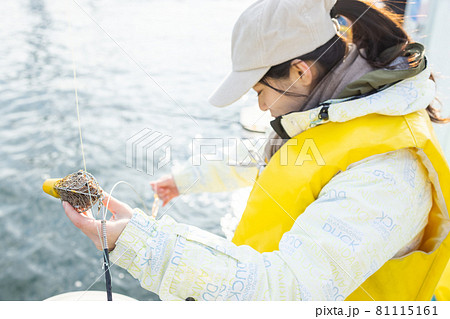 Young woman enjoying fishing - Stock Photo [81115162] - PIXTA