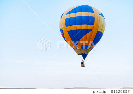 Multicolored air balloon in clear blue sky Multicolored air balloon in clear blue sky 81126837