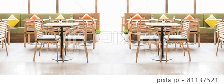 Simple table and chair set in a restaurant Simple table and chair set in a restaurant 81137521